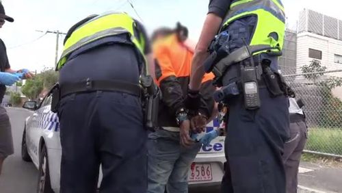 Victoria police arresting a person as part of Operation Mater. (A Current Affair)