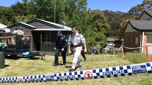 New South Wales police are seen on the property where Belinda Peisley last lived in Katoomba, New South Wales, Monday, December, 3, 2018.