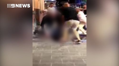 Several people can be heard shouting ans screaming as the brawl unfolds. (9NEWS)