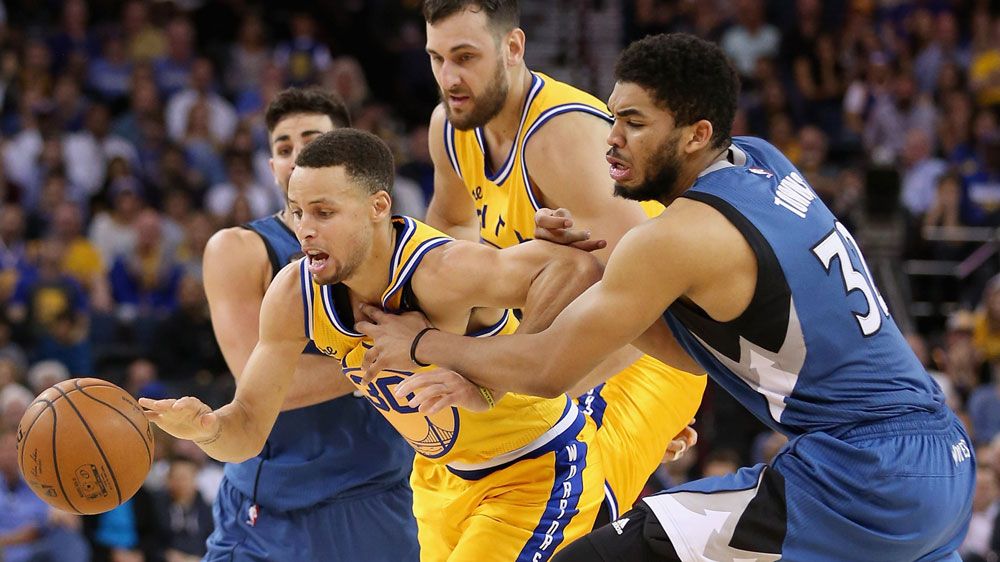 Steph Curry is mauled in the Warriors' shock loss to Minnesota. (Getty)