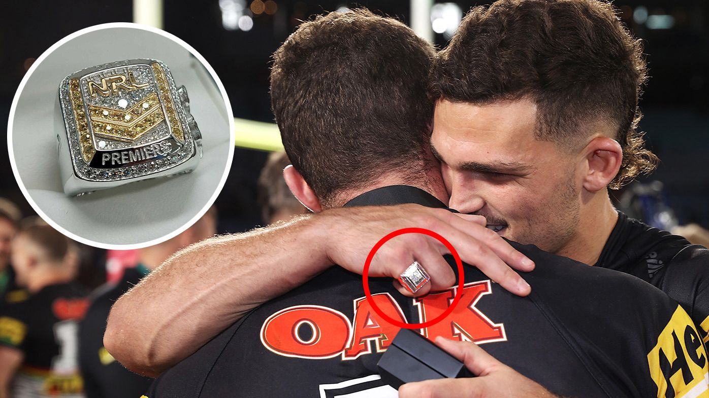 Nathan Cleary hugs Dylan Edwards following the 2022 NRL grand final, with an insert of the 2023 premiership ring.