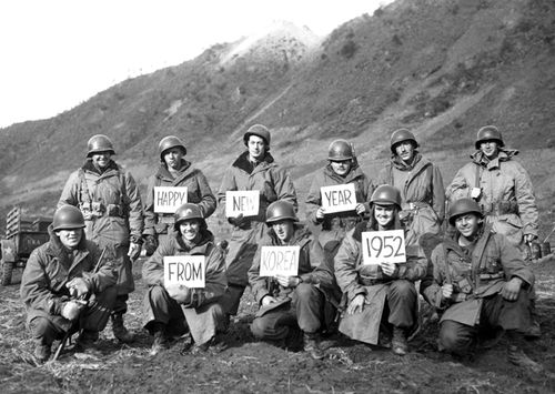 Missouri soldiers from the 19th Infantry Regiment pose for a group portrait, along the Kumsong front, to wish folks back home a Happy New Year, during the Korean War, December 1951. (Photo by Interim Archives/Getty Images)