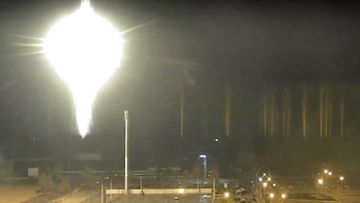 This image made from a video released by Zaporizhzhia nuclear power plant shows bright flaring object landing in grounds of the nuclear plant in Enerhodar, Ukraine Friday, March 4, 2022. 