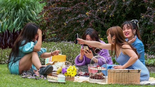 A group of friends enjoying a picnic at the Royal Botanic Gardens on October 19, 2020 in Melbourne.