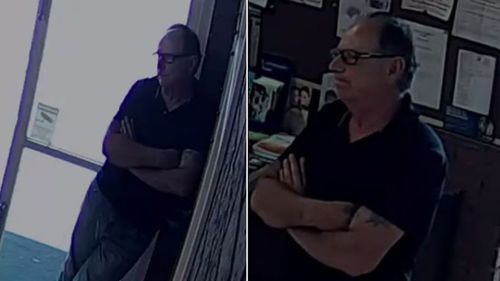 The man police allege is behind the robbery captured on CCTV loitering in the church foyer. (Victoria Police)