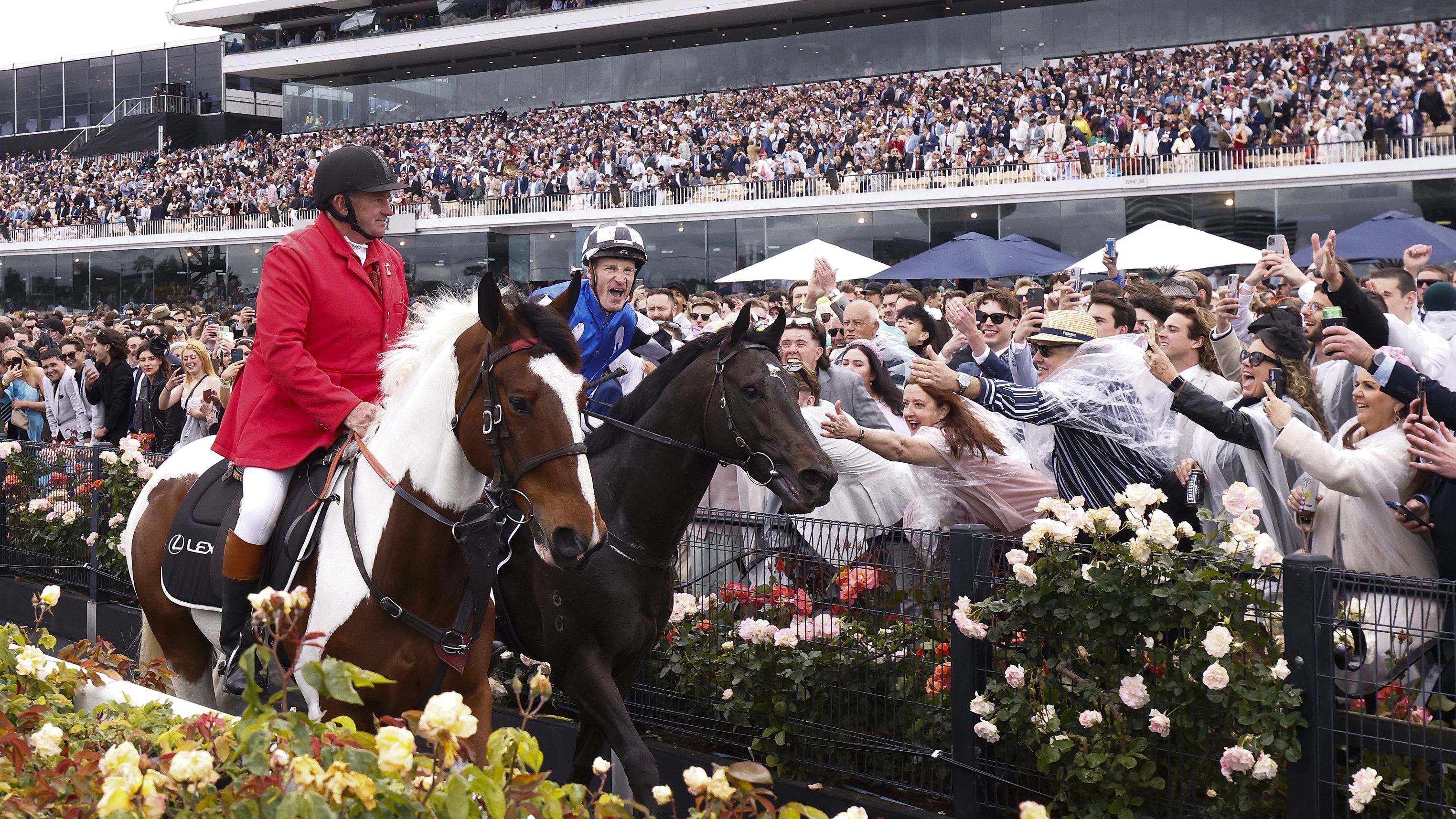 Mark Zahra riding #1 Gold Trip celebrates with spectators after winning race seven, the Lexus Melbourne Cup.