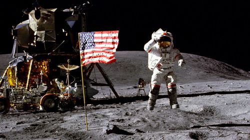 In this April 1972 photo made available by NASA, John Young salutes the U.S. flag at the Descartes landing site on the moon during the first Apollo 16 extravehicular activity. (NASA)