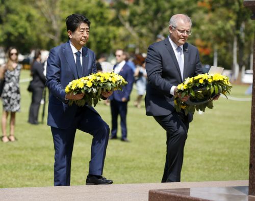 Shinzo Abe and Scott Morrison laid wreaths at the Darwin Cenotaph, 77 years after Japan bombed the city.