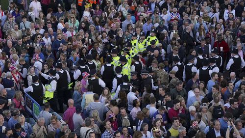 Crowds gather for the concert at Windsor Castle in Windsor, England, Sunday, May 7, 2023, celebrating the coronation of King Charles III. It is one of several events over a three-day weekend of celebrations. (Jonathan Brady/Pool Photo via AP)