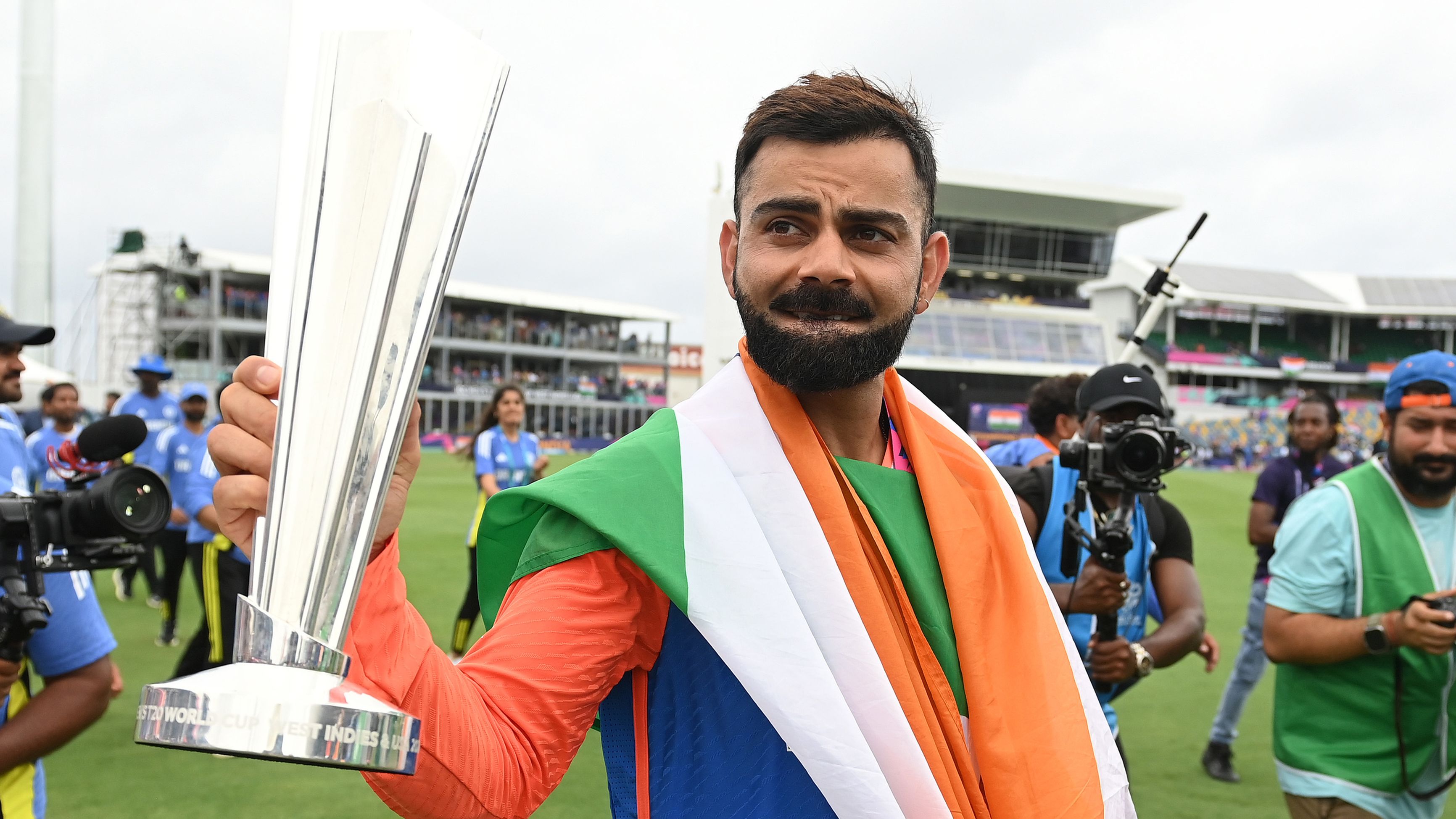 Virat Kohli holds the trophy during a lap of honour after India won the ICC Men&#x27;s T20 Cricket World Cup West Indies &amp; USA 2024 Final match between South Africa and India at Kensington Oval on June 29, 2024 in Bridgetown, Barbados. (Photo by Philip Brown/Getty Images)