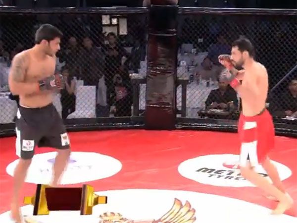 Indian MMA fighter Amitesh Chaubey unleasehes a short right to floor Jason Solomon. (Supplied)