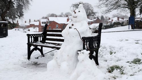 Not everyone was inconvenienced by the snow, with snowmen popping across the UK. (AAP)