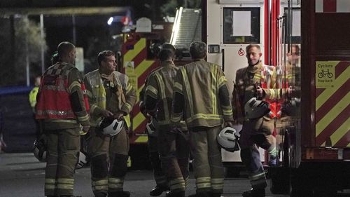 Firefighters at the scene in Sutton, south London, where four children have died following a fire at a house. Picture date: Thursday December 16, 2021. PA Photo. See PA story FIRE Sutton. Photo credit should read: Kirsty O'Connor/PA Wire