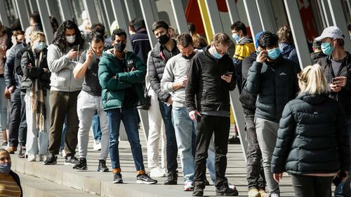 People queuing up at the Melbourne Exhibition Centre vaccine hub yesterday.