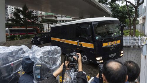 A Correctional Services Department vehicle arrives at the West Kowloon Magistrates' Courts in Hong Kong Tuesday, Nov. 19, 2024, ahead of the sentencing in national security case. (AP Photo/Chan Long Hei)