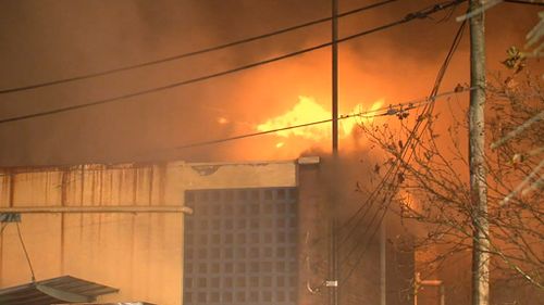 The blaze threatened neigbouring buildings. (9NEWS)