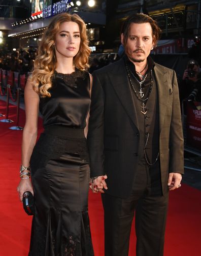 Amber Heard (L) and Johnny Depp attend the Virgin Atlantic gala screening of "Black Mass" during the BFI London Film Festival at Odeon Leicester Square on October 11, 2015 in London, England. 