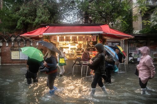 Residents and businesses typically reinforce their doors with metal or wooden panels to prevent flooding. But photos show shop owners using water pumps to protect their wares.