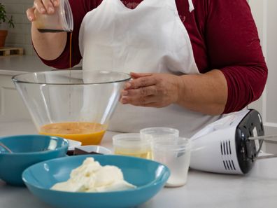 Woman baking birthday cake