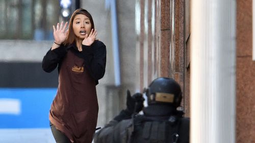 She was one of five hostages to escape with at least 10 more feared inside the Martin Place shop. (Getty)