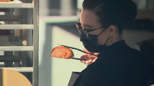 Hundreds of people queued for hours in South Brisbane to get their lips around a world-famous croissant today, raising questions over whether a gourmet bakery outing should be considered 'essential' under COVID-19 lockdown restrictions.