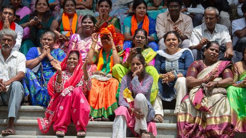 India election 2024 - Supporters of the Bharatiya Janata Party (BJP) watch a giant screen telecasting election results live on June 04, 2024 in Bengaluru, India