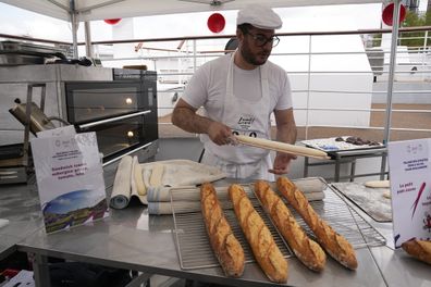 French baker Tony Dore prepares baguettes, like those that will be served during the. Olympic Games, Tuesday, April 30, 2024 in Paris. 