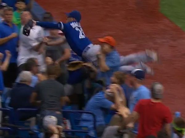 Baseballer dives into crowd for stunning catch