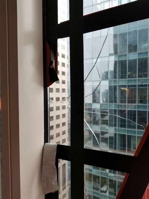 An undated photo provided by the San Francisco Department of Building Inspection shows a window that has cracked in the Millennium Tower.
