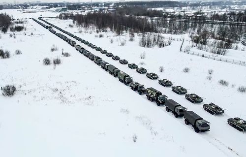 Military vehicles of Russian peacekeepers are parked waiting to be uploaded on Russian military planes at an airfield in Russia. Over 70 cargo planes are being deployed in Russia's peacekeeping mission in Kazakhstan