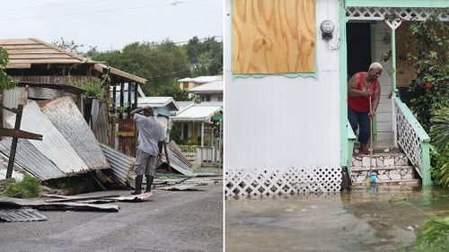 A man surveys the wreckage on his property and a woman pushes out floodwaters on her property after the passing of Hurricane Irma, in St. John's, Antigua and Barbuda. (AP)