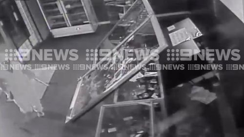 The trio run in and steal two bottles of soft drink. (9NEWS)