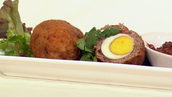Baharat scotch eggs with spicy tomato sauce