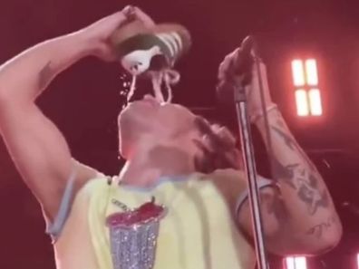Harry Styles does shoey onstage as he kicks off Aussie tour in Perth.