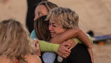 Embrace for Westfield victim's friend in beach tribute