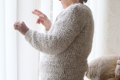 nosy neighbour at window