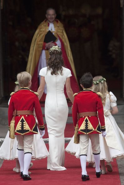 Pippa escorting younger members of the bridal party into the venue.