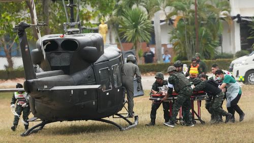 A wounded Thai soldier is carried to be transferred to a hospital, in Surin province, Thailand, Wednesday, Dec. 10, 2025, following clashes between Thai and Cambodian soldiers. (AP Photo/Sakchai Lalit)