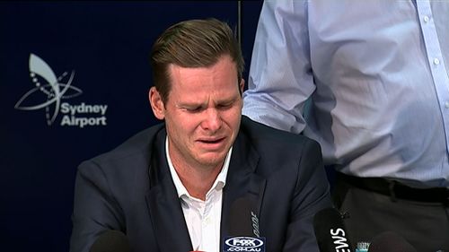 Steve Smith's father puts a comforting hand on his son's back during his raw press conference last night. Picture: 9News