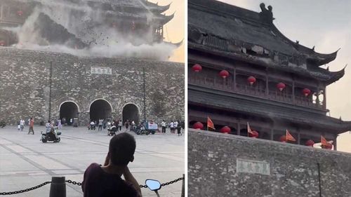 This screengrab taken from a video shows roof tiles collapsing from a centuries-old Chinese drum tower in Anhui, China, on May 19, 2025.