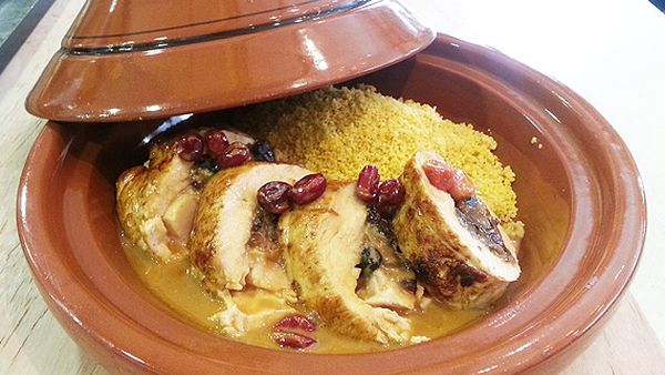 Middle Eastern turkey tagine with carrot couscous and rose petals
