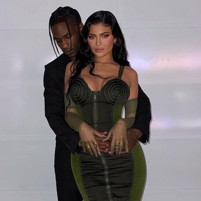 Travis Scott and Kylie Jenner post for cosy photo on Instagram.