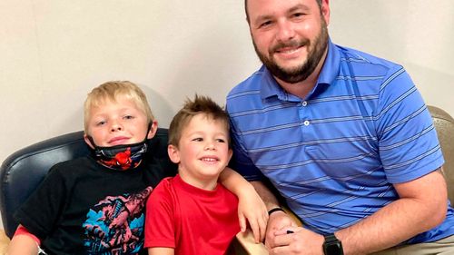 From left, 7-year-old Russell Bright, 5-year-old Tucker Bright, and dad Adam Bright pose for a picture at Ochsner Medical Center in Jefferson. Tests of Pfizer's COVID-19 vaccine started in Louisiana for children ages 5 through 11 in June.