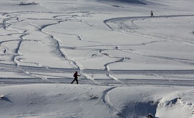 <p>Italy: People cross-country ski in Piani di Pezza, near Rocca di Mezzo</p>