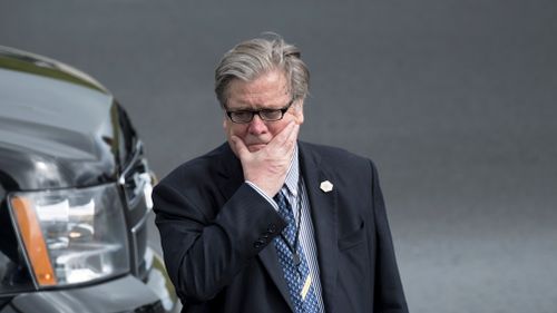 Steve Bannon waits as US President Donald Trump arrives at Lynchburg Regional Airport in Lynchburg, Virginia on May 13, 2017. (AFP)