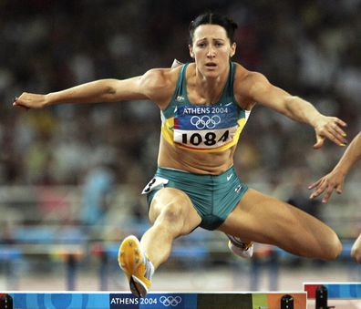 Jana Pittman, of Australia, runs in a semifinal of the 400m hurdles at the 2004 Olympic Games Sunday, Aug. 22, 2004 in Athens, Greece. Pittman qualified for the final. (AP Photo/Mark Baker)