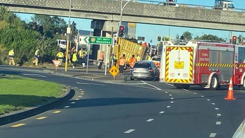 A truck has rolled on a road in Auckland, spilling glue.