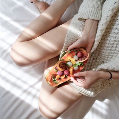 Woman holding fruit