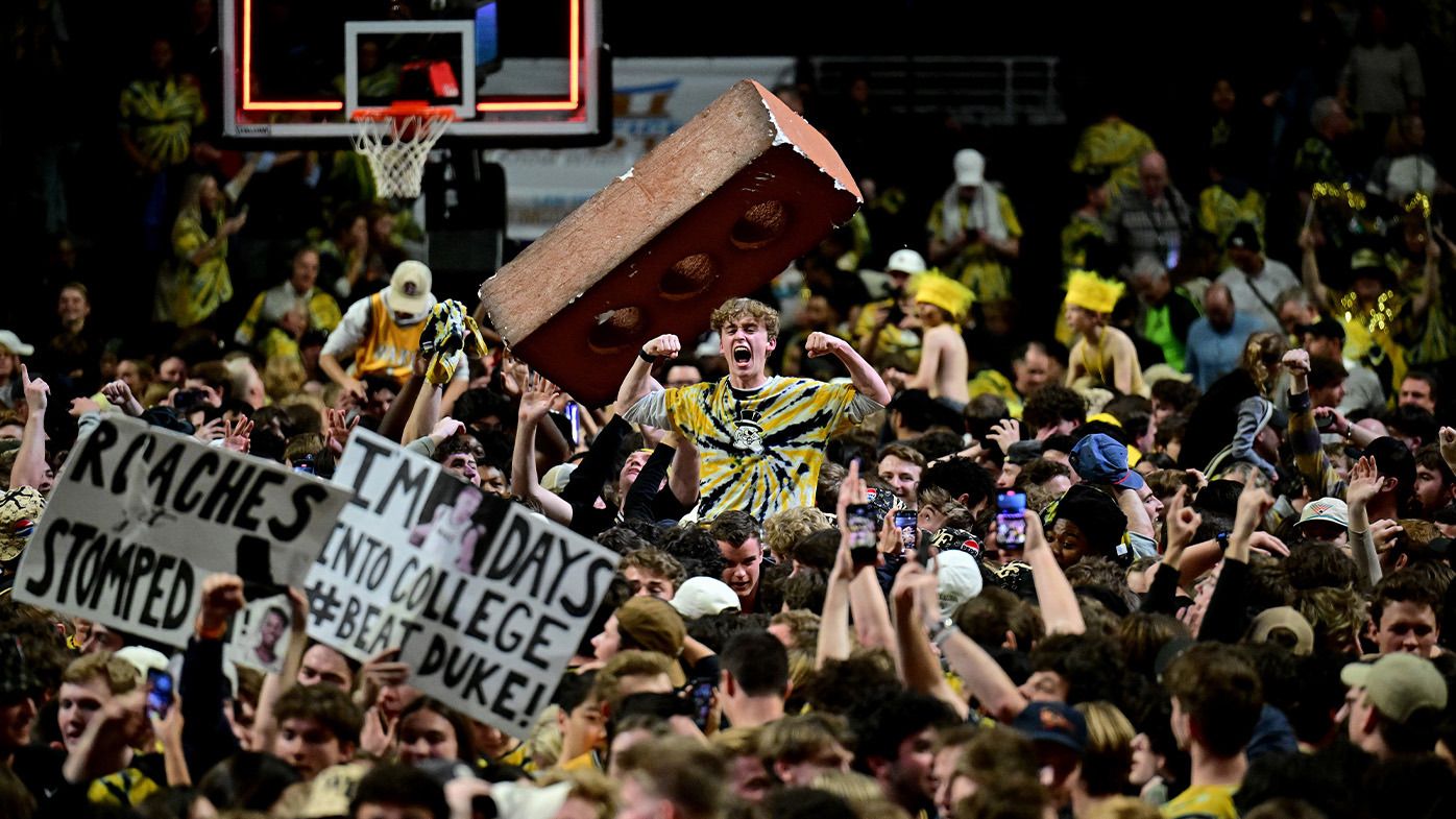 Fans storm the court.