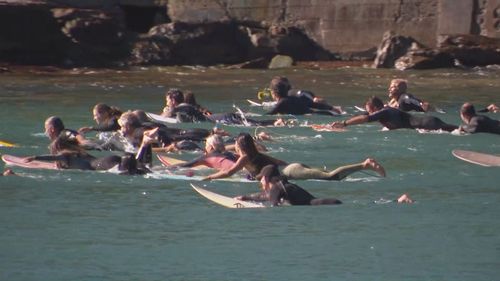 Some took to the water with sunflowers for Mark Sanguinetti.